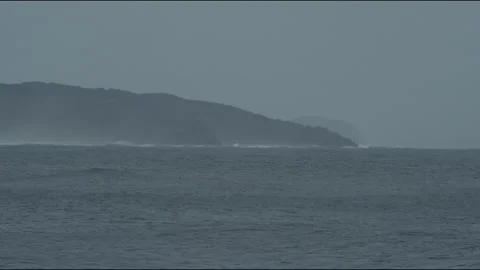 Ocean waves rolling by the headland Stock Footage 169067552