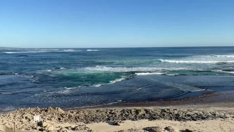Ocean Waves Rolling Over Shallow Coastal Tide Pool Stock Footage 339584102