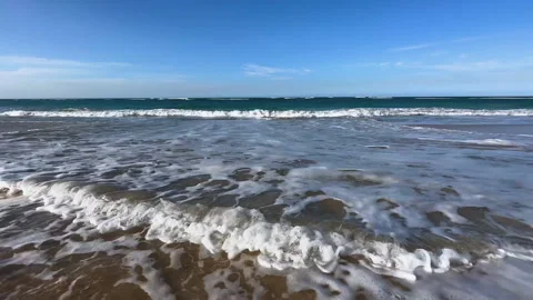 ocean waves rolling onto the sand to fil... | Stock Video | Pond5