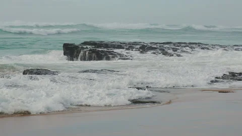 Ocean waves rolling on a sandy beach in misty foggy weather. Stock Footage 199152235