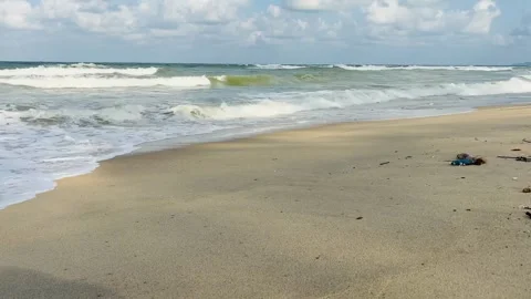 Ocean Waves Rolling onto a Sandy Beach in Kuala Terengganu, Malaysia Stock Footage 328336108