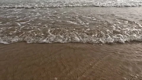 Ocean waves rolling on the sandy beach in sunny day Stock Footage 341466438
