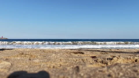 Ocean Waves Rolling onto a Sandy Beach in Mukho, South Korea Stock Footage 344778141
