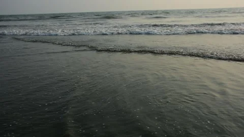 Ocean Waves Rolling onto Sandy Shore Stock Footage 331765603