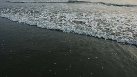 Ocean Waves Rolling onto Sandy Shore Stock-Footage 331765711