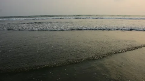 Ocean Waves Rolling onto Sandy Shore Stock Footage 331765836