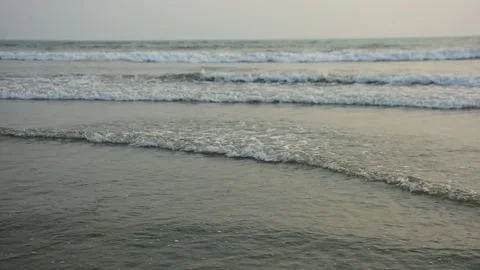 Ocean Waves Rolling onto Sandy Shore Stock Footage 331765842