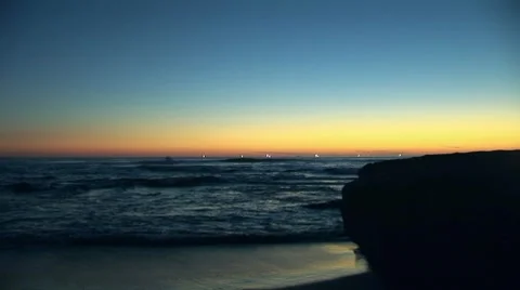 Ocean Waves Rolling Into Shore at Sunset Stock Footage 7731493