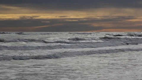 Ocean Waves Rolling In At Sunset Stock Footage 125470078