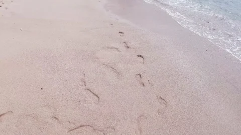 Ocean,  waves , sand with footprints Stock Footage 116624061