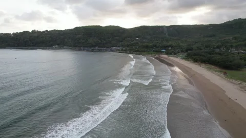 Ocean waves sandy beach in Pacitan Java Indonesia Stock Footage 259575482