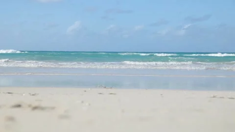 Ocean waves on a sandy beach at summer day in tropical island Stock Footage 127127428