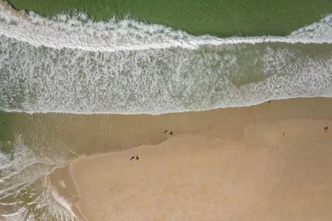 Ocean waves, sandy beach, view from drone, Carnota beach, Galicia, Spain Stock Photos