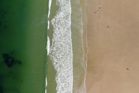 Ocean waves, sandy beach, view from drone, Carnota beach, Galicia, Spain Stock Photos