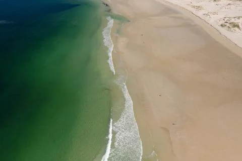 Ocean waves, sandy beach, view from drone, Carnota beach, Galicia, Spain Stockfoto's