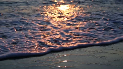 Ocean waves on a sandy tropical beach at sunset Stock Footage 57151122