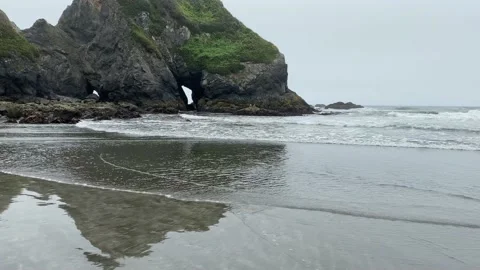 Ocean waves slow calm shoreline moving island rock formation video Stock Footage 174970610