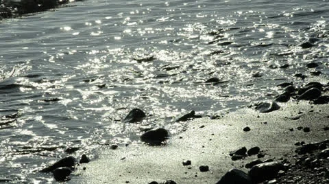 Ocean waves at sone beach, backlit Stock Footage 23576461