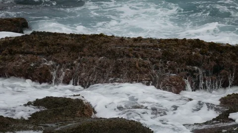 Ocean Waves splash against rocks in the coast of Buzios, Brazil Stock Footage 92074631