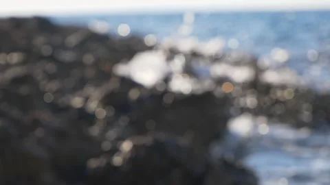 Ocean waves splash white foam against dark rugged rocky coast Stock Footage 337410953