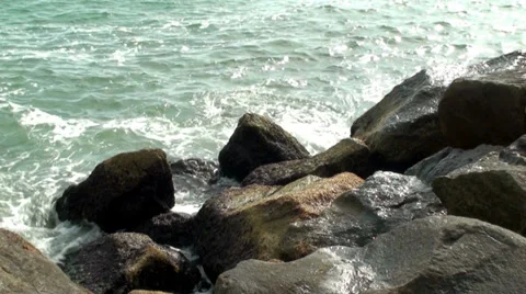 Ocean waves splashing against the rocks Stock Footage 37669786