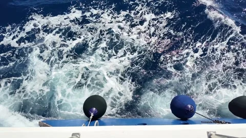 Ocean waves splashing against a ship's bow with dynamic sea motion Stock Footage 331432488