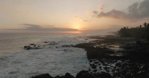 Ocean waves splashing on black reef on wild beach in tropical paradise. Stock Footage 246660238