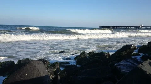 Ocean waves splashing on black rocks in Bay of Bengal Ocean Pondicherry Stock Footage 62914547