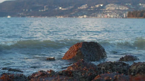 Ocean waves splashing on boulders Stock Footage 297922878