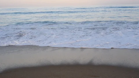 Ocean waves splashing on shore at dusk sunset Stock Footage 118058879