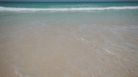 Ocean waves splashing on white sandy beach. Tropical view, bright sunshine. Stock Footage 84970017