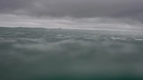Ocean waves with stormy ominous sky. Point of view of being in water. Stock Footage 227119680