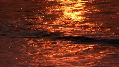 Ocean Waves at Sunrise with Amber Reflection Video stock 86195175