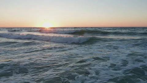 Ocean Waves in Sunrise Stock Footage 138171540