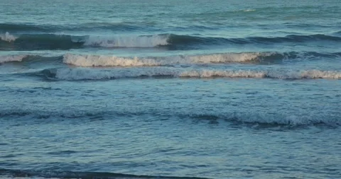 Ocean waves at sunset creating tranquil seaside scene. Stock Footage 303816073