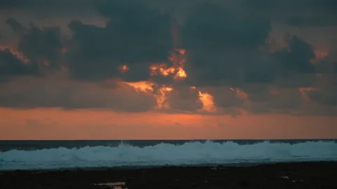 Ocean waves at sunset with dramatic clouds Stock Footage 303395074