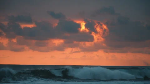 Ocean waves at sunset with dramatic clouds Stock Footage 303395915