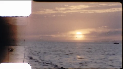 Ocean Waves Sunset Sky Clouds Crimson Twilight Dusk Dawn Vintage Film Home Movie Stock Footage 114769619