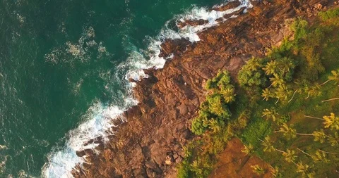 Ocean waves at sunset. Sri Lanka. Beautiful tropical beach with palm. Video stock 116410665