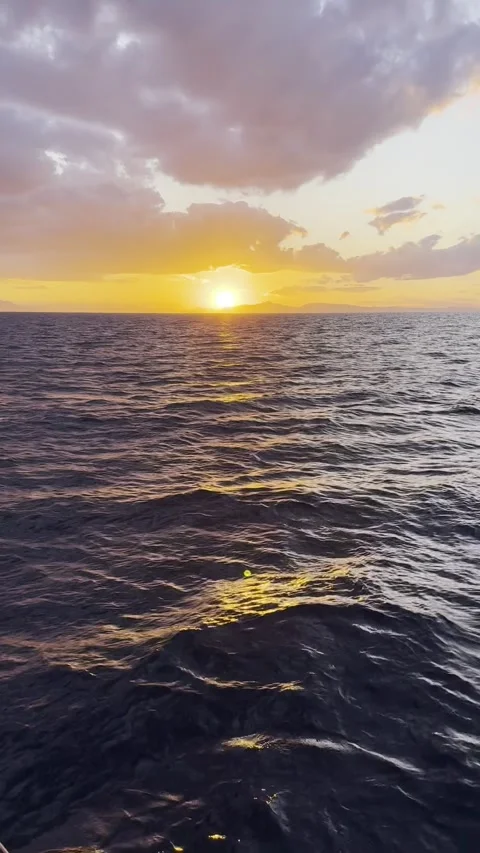 Ocean Waves at Sunset Viewed from a Moving Boat Stock Footage 336964958