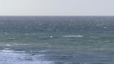 Ocean waves with surfers - view from the steep coast - natural water background Stock Footage 143853551
