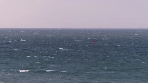Ocean waves with surfers - view from the steep coast - natural water backgroud Stock Footage 143858312