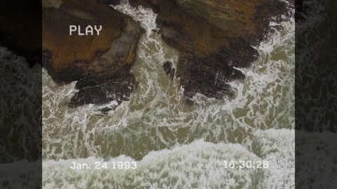Ocean waves surging against rocks triggered by rising tide showing surf pulse Stock Footage 312468345