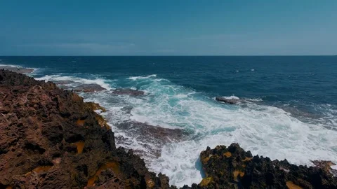 Ocean Waves Swirling on Ancient Million-Year-Old Red Coral Reef Shelf Stock Footage 337583169
