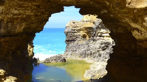 Ocean waves through arch Stock Footage 119618879