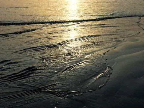 Ocean waves touching the beach Stock Photos