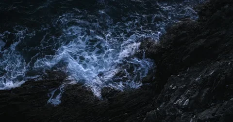 Ocean Waves at Twilight Against Rocky Shore Stock Footage 313792855