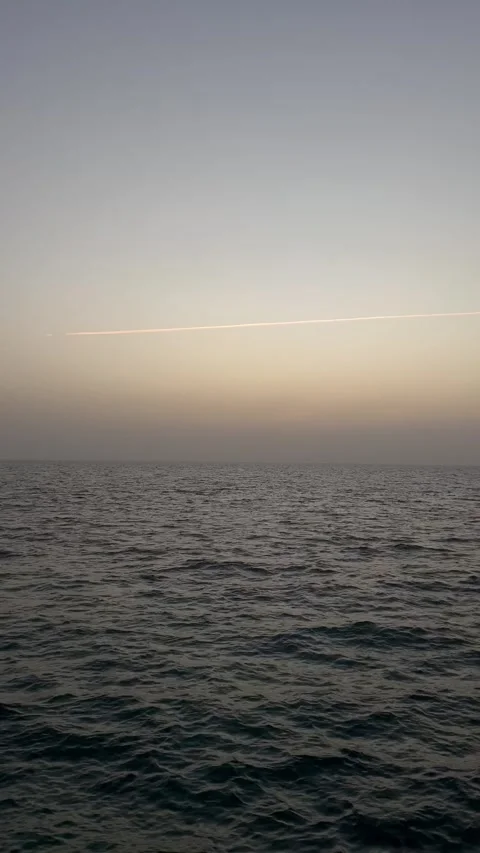 Ocean Waves Under Pastel Evening Sky | Fishing Pier View Stock Footage 342215541