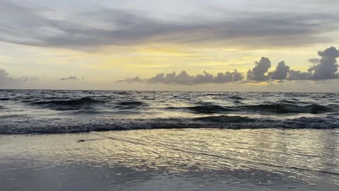Ocean Waves Wash Onto Florida Beach at Golden Hour Sunset Stock Footage 345964801