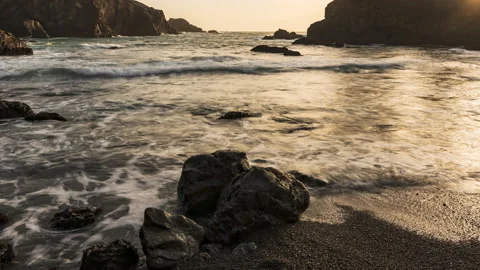 Ocean waves wash over foreground rocks - timelapse Stock-Footage 219354852